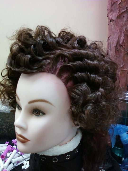 perm sett hairstyle on a mannequin