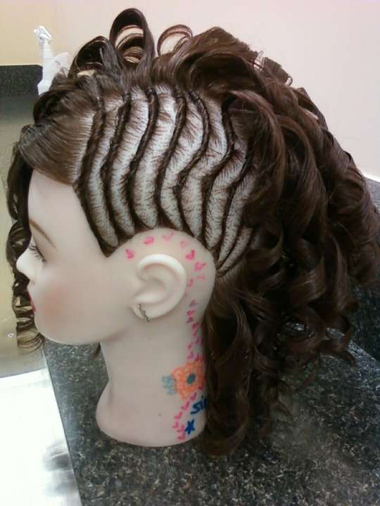 flat twists with barrel curls on a mannequin