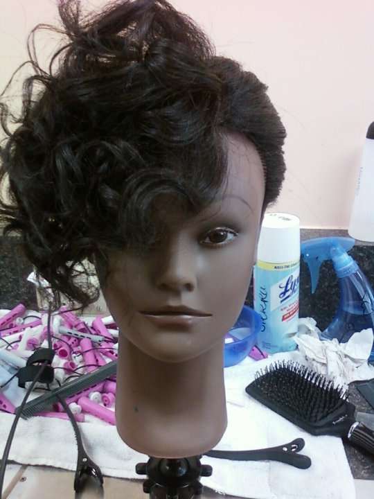 curly bang with marcel iron on a mannequin