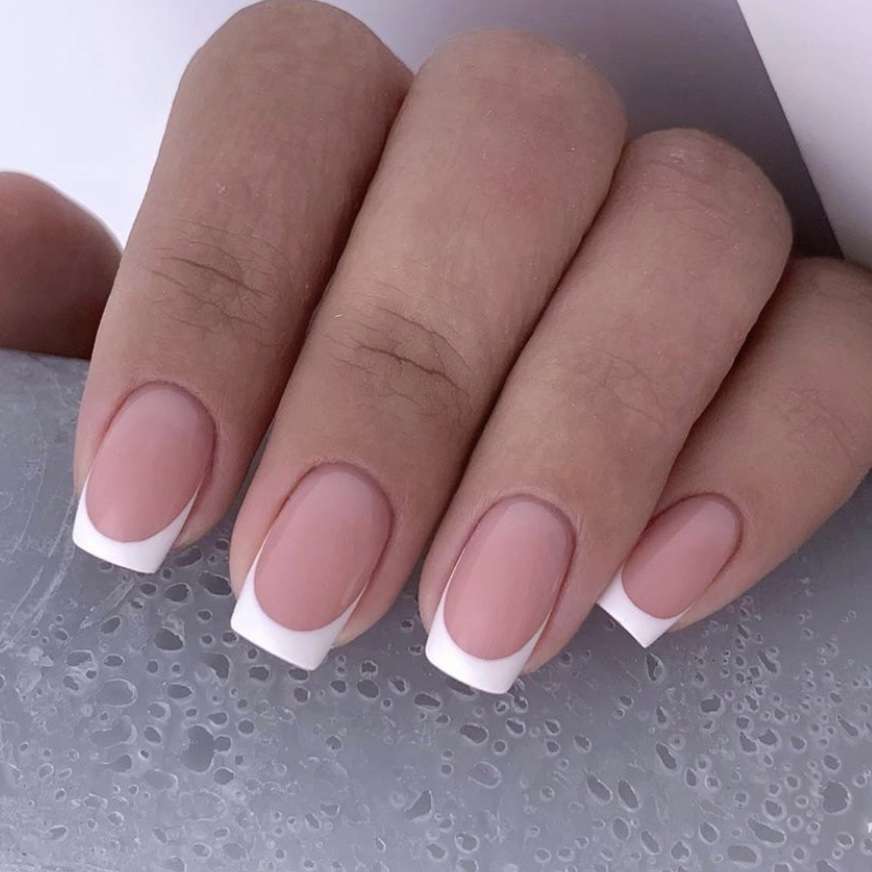  a French Manicure on medium short length nails