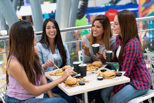 smart shopping with friends eating at a mall