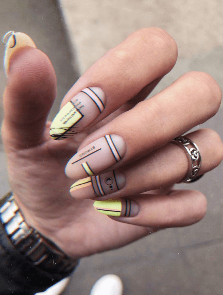 Nude colored nails with lined color block geometric nail art designs