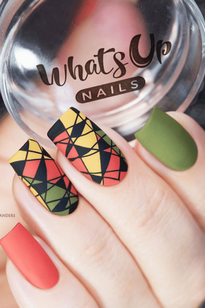 Yellow, red, green and black lined geometric nail art designs