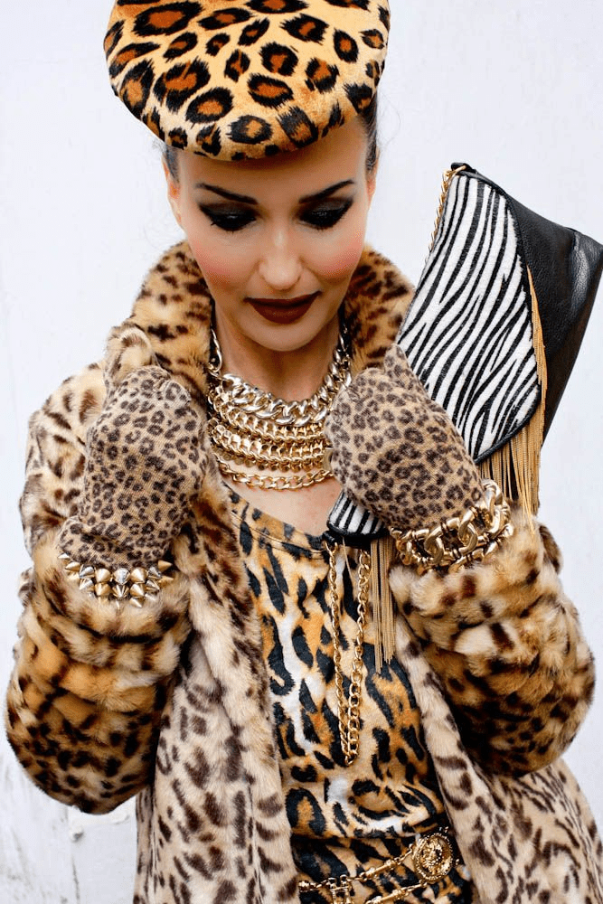 A mixture of different style animal prints coat, gloves, and clutch bag, best fall and winter fashion trends