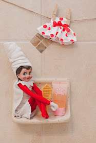 Elf on the shelf hiding in the bathroom