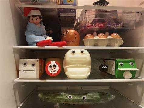 Elf hiding in the refrigerator