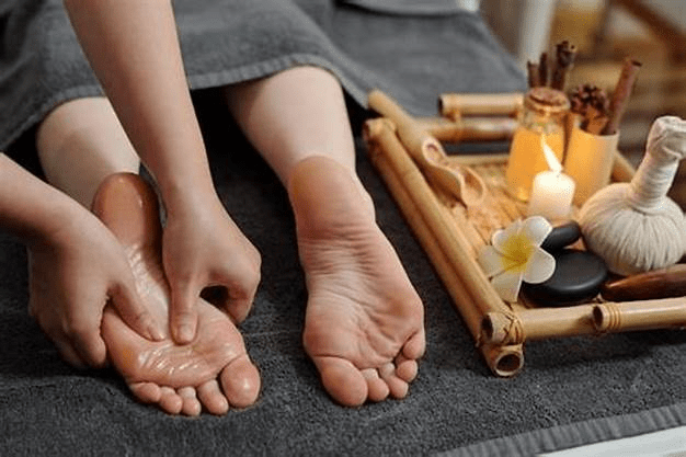 Winter foot care massage with hot rocks